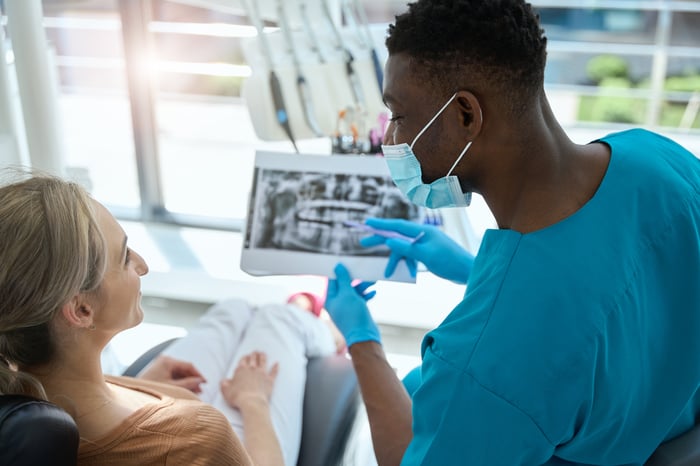 man-and-woman-discussing-x-ray-in-the-clinic-2024-10-18-16-57-49-utc