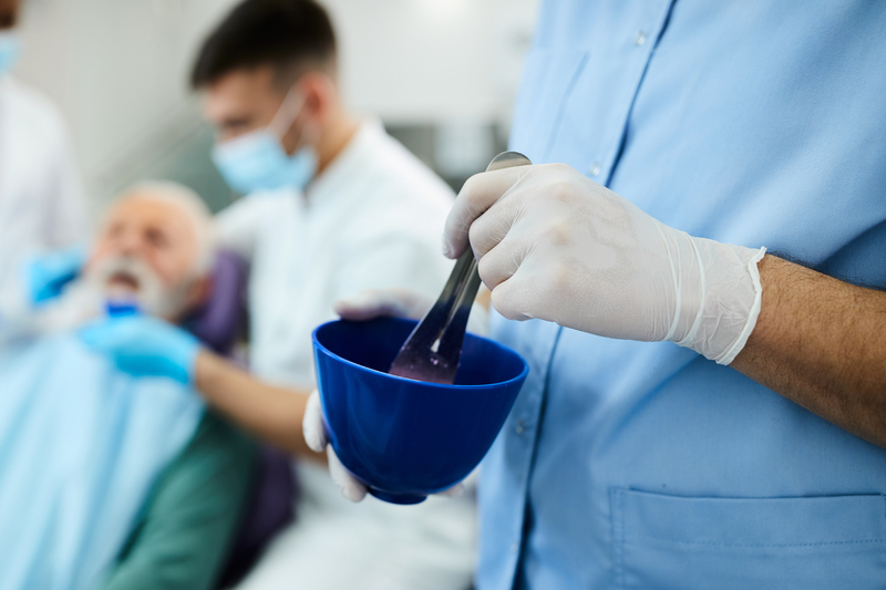 close-up-of-dental-assistant-mixing-material-for-d-2024-12-13-20-41-50-utc-1