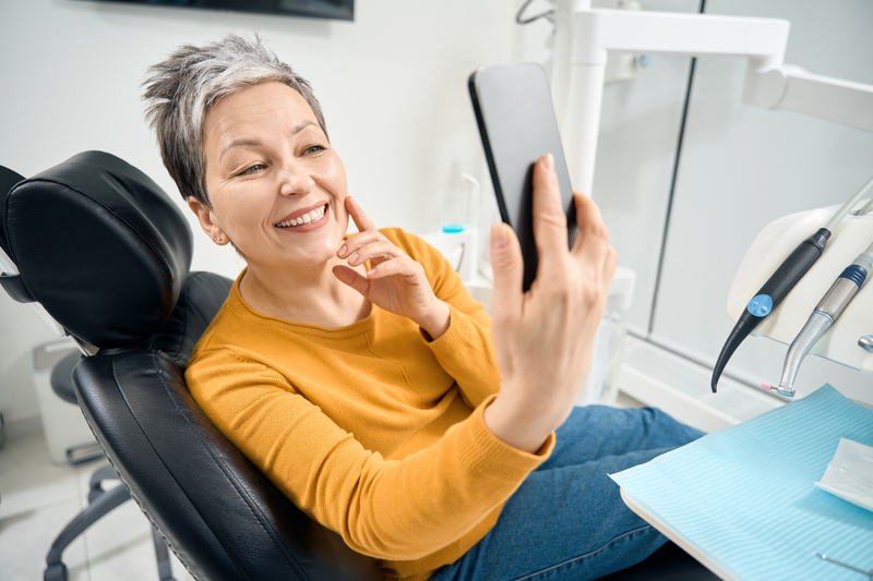 woman-sitting-in-medical-chair-and-making-selfie-o-2024-10-22-12-24-05-utc-1